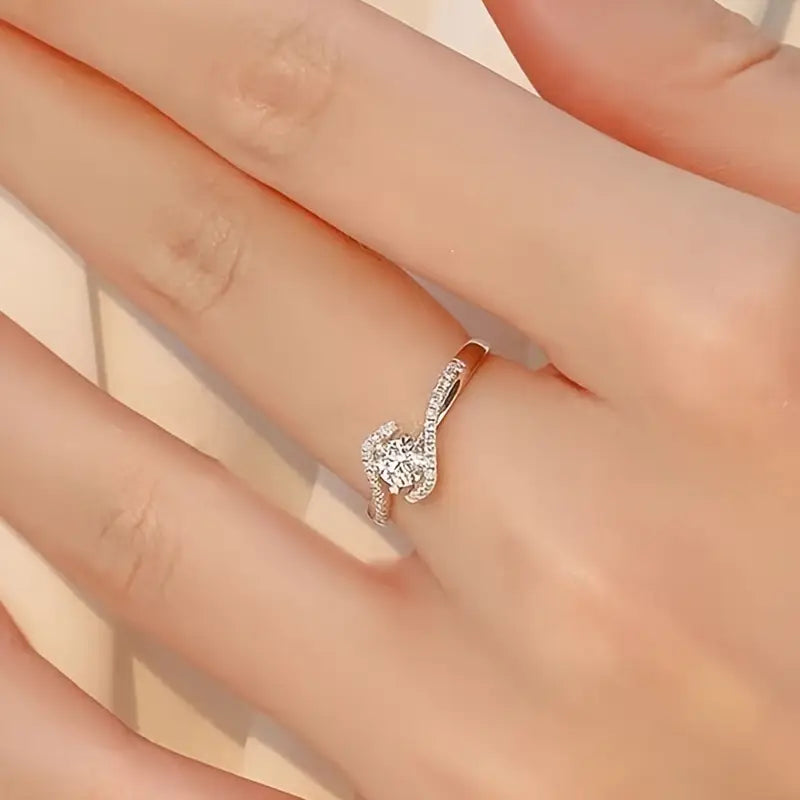 Elegant Hollowed Out Twisted Four Claw Circular Engagement Ring