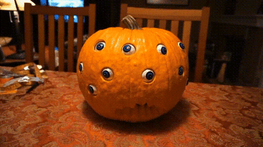 Spooky Halloween Pumpkin Decoration with Rotating Eyeballs