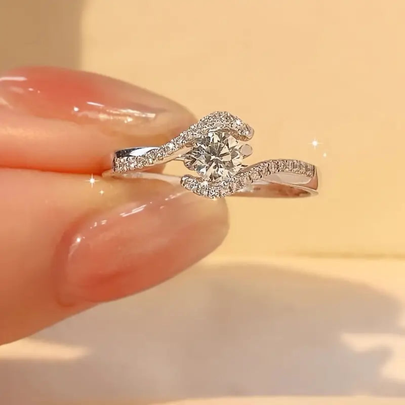 Elegant Hollowed Out Twisted Four Claw Circular Engagement Ring