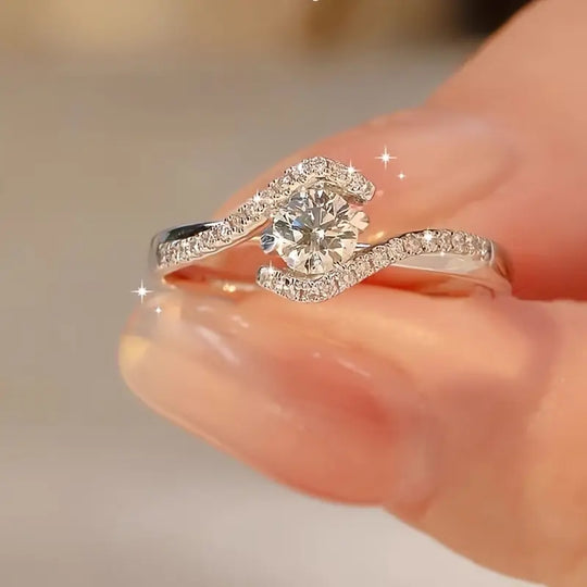 Elegant Hollowed Out Twisted Four Claw Circular Engagement Ring