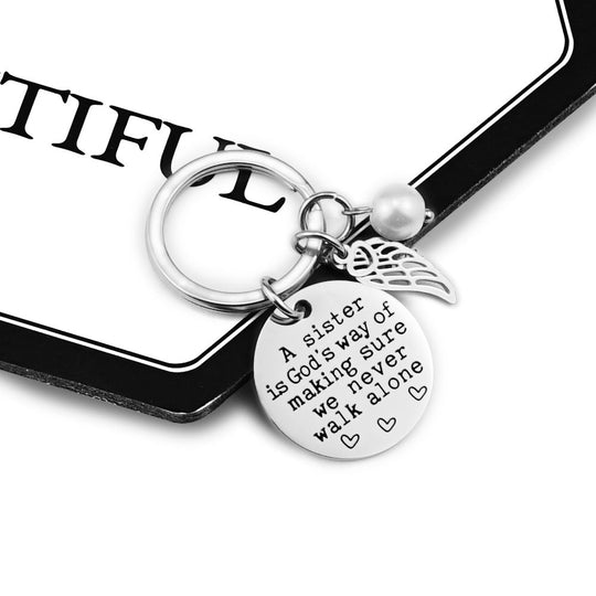 A Sister is God's Way of Making Sure We Never Walk Alone Keychain Keychain GrindStyle 